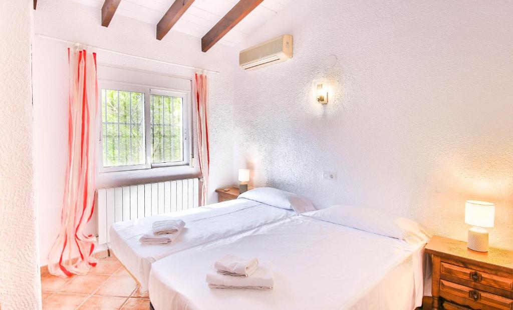 A bed or beds in a room at Marquesa JJ