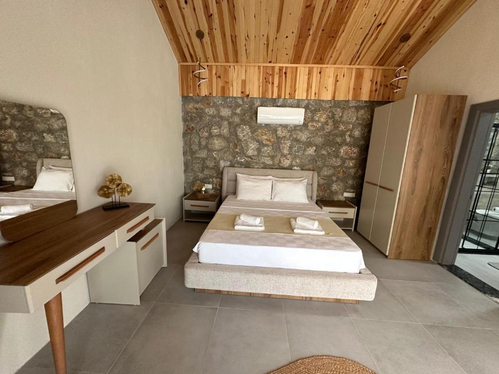 Adrasan Siderya kuzey villa客房内的一张或多张床位