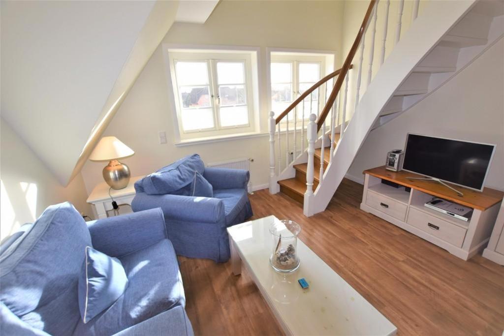 TV a/nebo společenská místnost v ubytování Landhaus Ruusenhüs, App 3