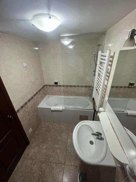Koupelna v ubytování Hotel Elegance