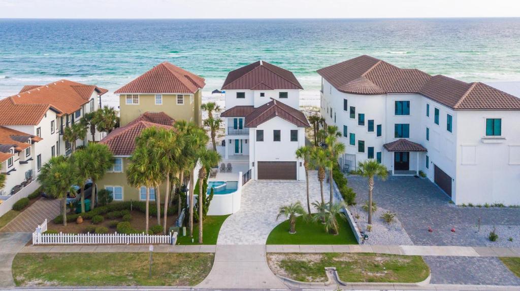 arial view of a villa with the ocean in the background at Queen Of Crystal Shores Luxury Beachfront Retreat in Destin