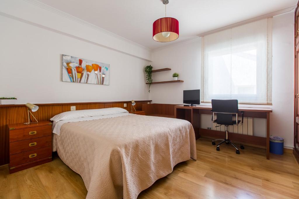 A bed or beds in a room at PR La Paz
