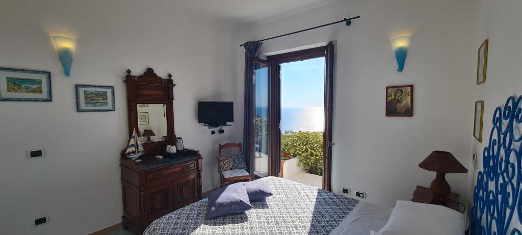 Postel nebo postele na pokoji v ubytování Guest House Villa Il Gabbiano