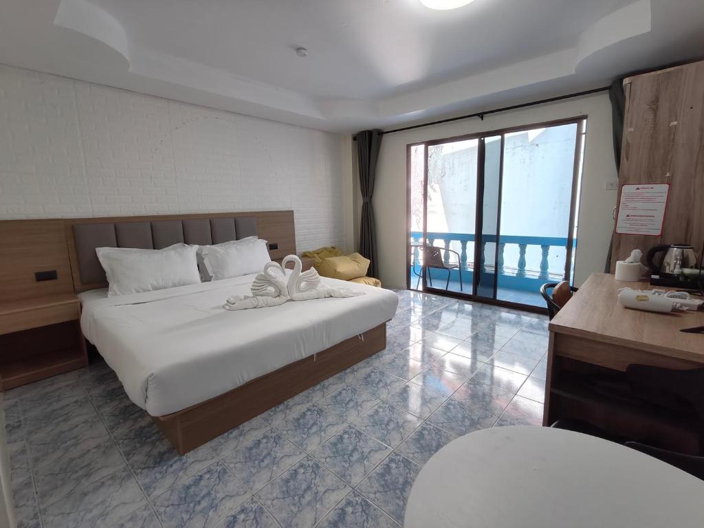 Postel nebo postele na pokoji v ubytování Baankasemsuk Resort 般咔 深宿