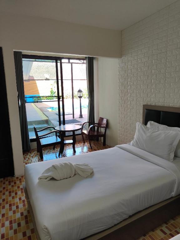 Postel nebo postele na pokoji v ubytování Baankasemsuk Resort 般咔 深宿