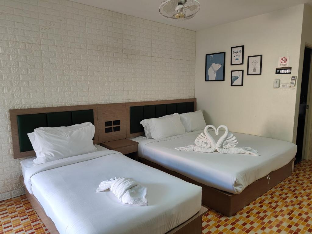 Postel nebo postele na pokoji v ubytování Baankasemsuk Resort 般咔 深宿