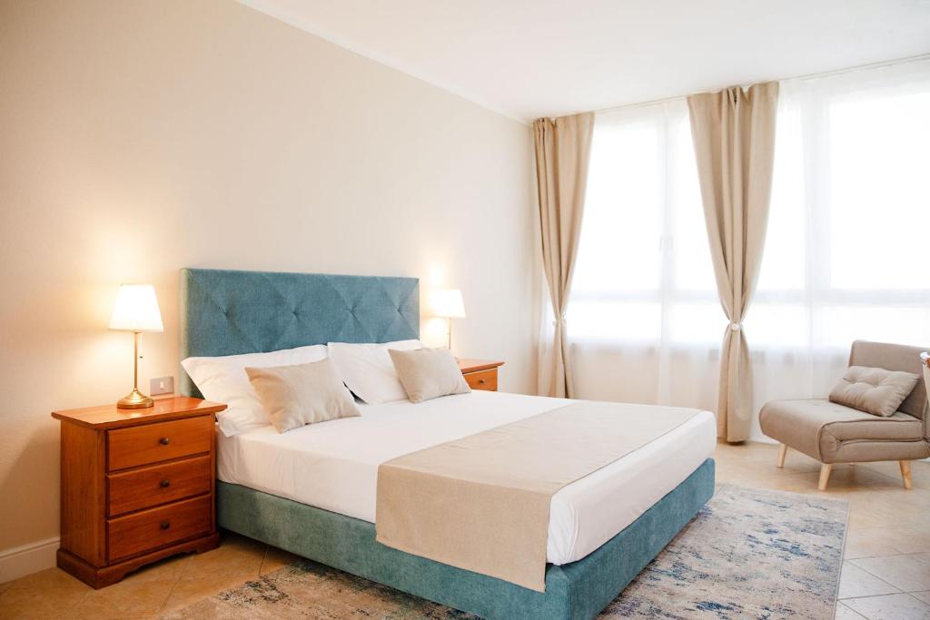 Postel nebo postele na pokoji v ubytování BELVEDERE MONFERRATO Relais & Wellness