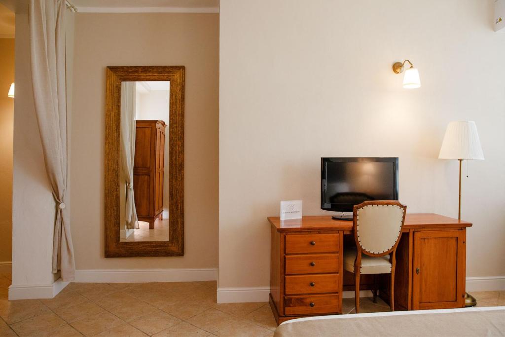 TV a/nebo společenská místnost v ubytování BELVEDERE MONFERRATO Relais & Wellness