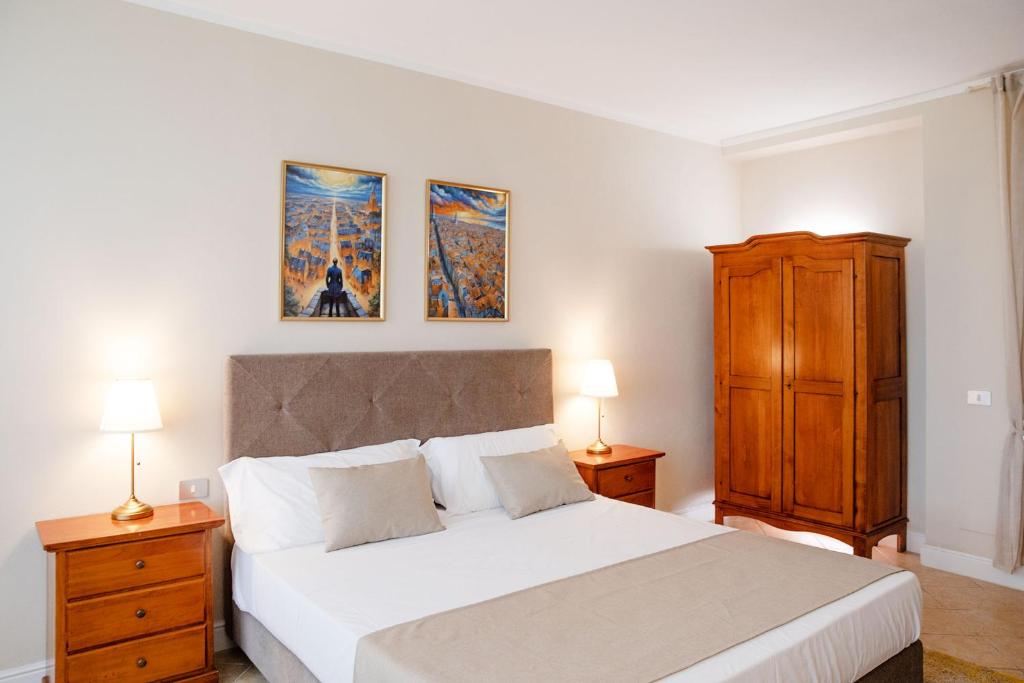 Postel nebo postele na pokoji v ubytování BELVEDERE MONFERRATO Relais & Wellness
