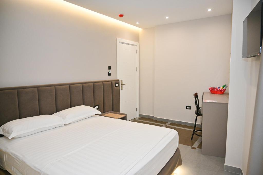 Postel nebo postele na pokoji v ubytování Hotel Vila Emes