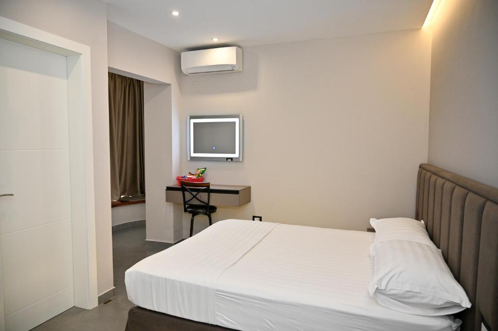 Postel nebo postele na pokoji v ubytování Hotel Vila Emes
