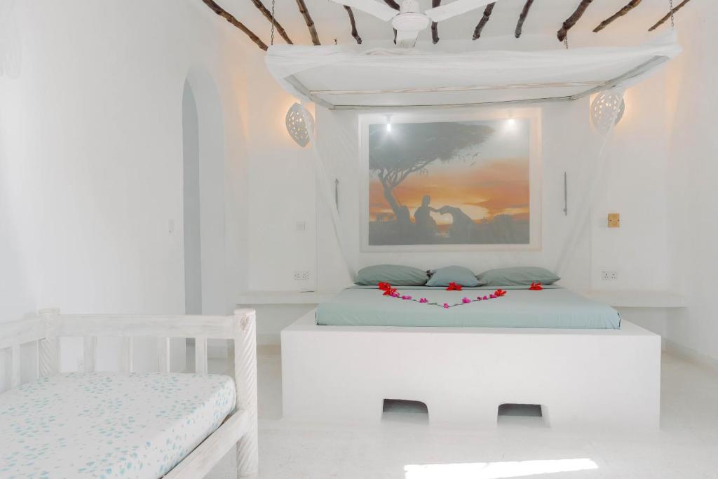 Postel nebo postele na pokoji v ubytování Baobab Village