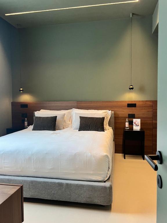 Postel nebo postele na pokoji v ubytování Palazzo Giusti Lecce - Exclusive Boutique hotel
