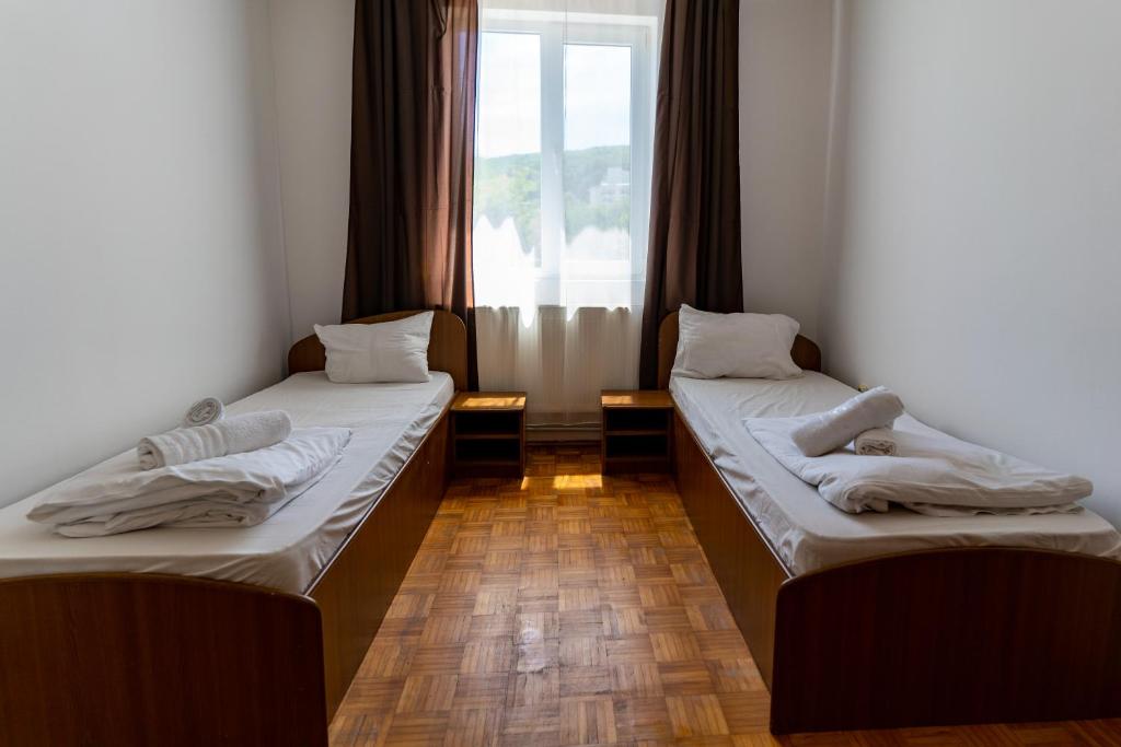Postel nebo postele na pokoji v ubytování ALEXANDRA Hotel