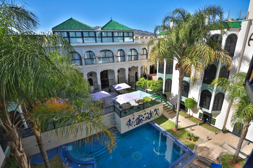 an aerial view of a building with a swimming pool at Riad Ommeyad Suite & Spa in Fez