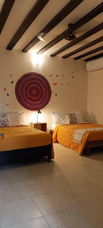 Llit o llits en una habitació de VALLADOLID 48 Hotel & Hostal