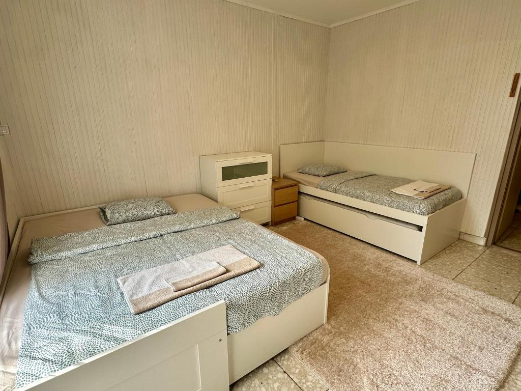 Posteľ alebo postele v izbe v ubytovaní Pálkövei 65. Apartman