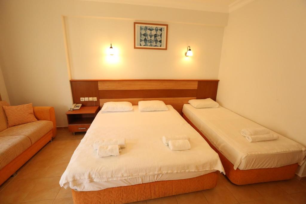 Postel nebo postele na pokoji v ubytování Mavruka Hotel