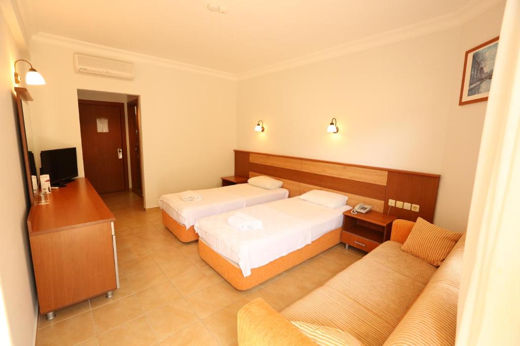 Postel nebo postele na pokoji v ubytování Mavruka Hotel