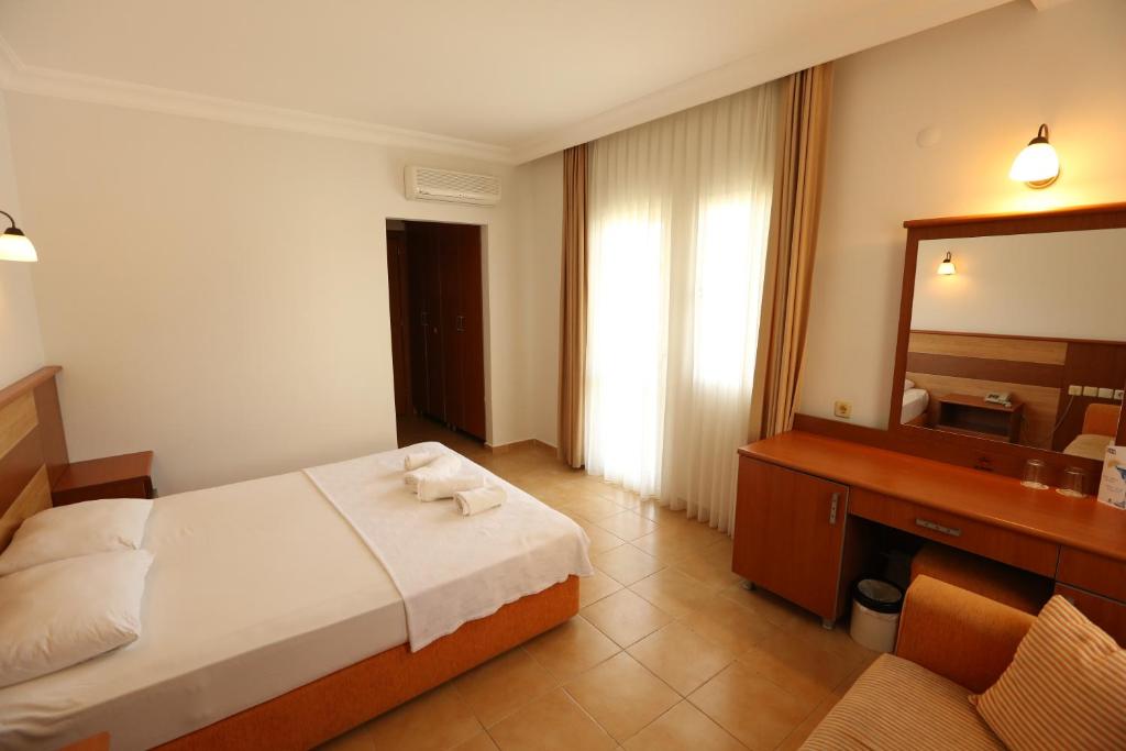 Postel nebo postele na pokoji v ubytování Mavruka Hotel