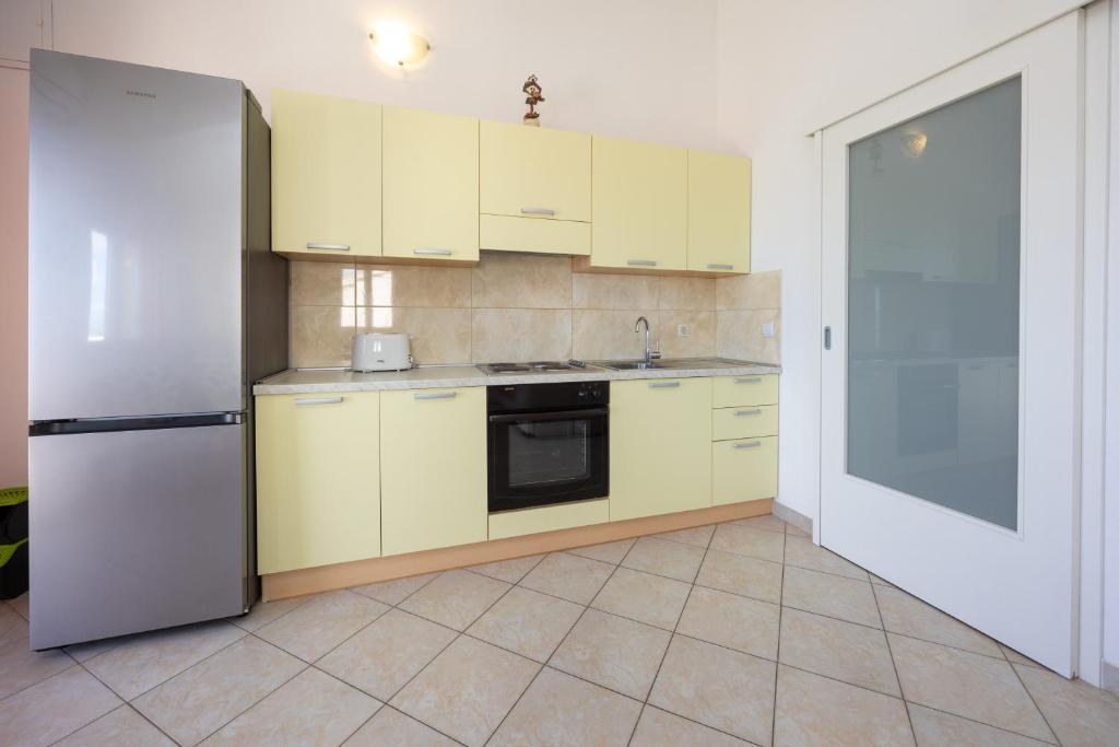Kuchyňa alebo kuchynka v ubytovaní Apartman Markulin