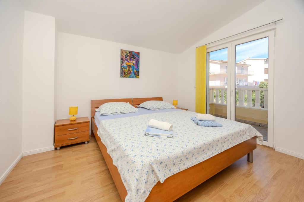 Posteľ alebo postele v izbe v ubytovaní Apartman Markulin