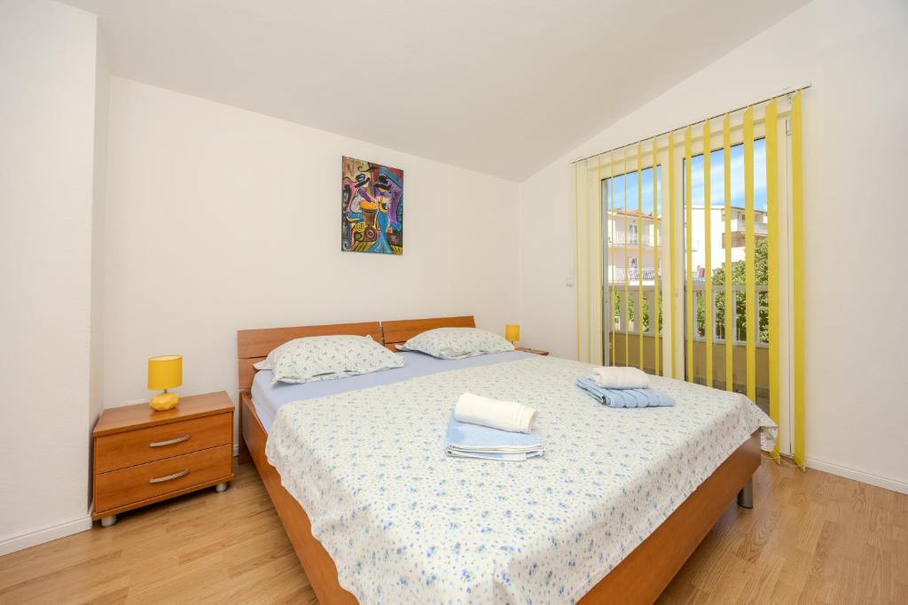 Posteľ alebo postele v izbe v ubytovaní Apartman Markulin