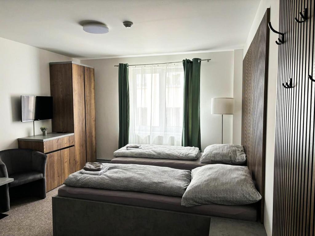 Postel nebo postele na pokoji v ubytování Apartmány Plzeň Zborovská 22 a