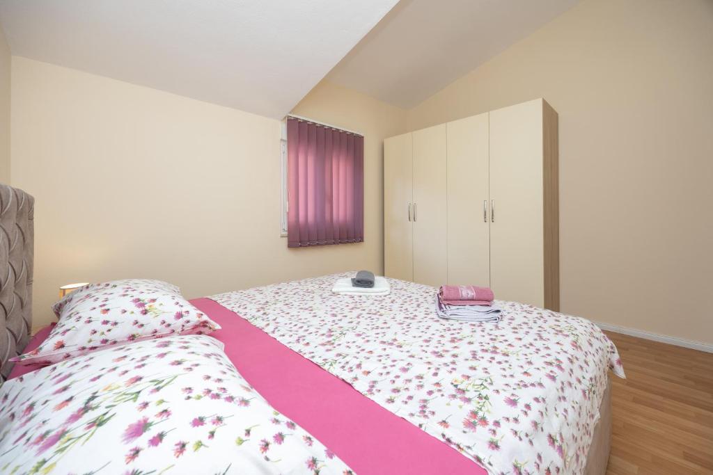 Posteľ alebo postele v izbe v ubytovaní Apartman Markulin