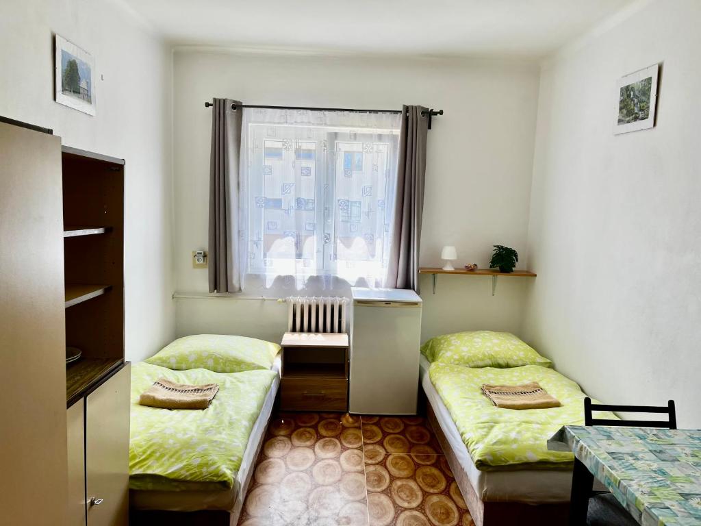Postel nebo postele na pokoji v ubytování Ubytování U Ropáků