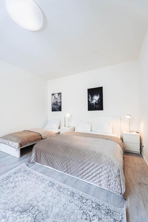 Postel nebo postele na pokoji v ubytování Silvie Apartments - Wurmova