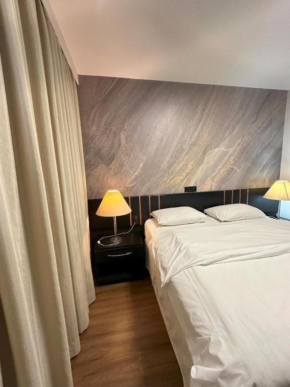 Postel nebo postele na pokoji v ubytování Sumatra Hotel e Centro de Convenções