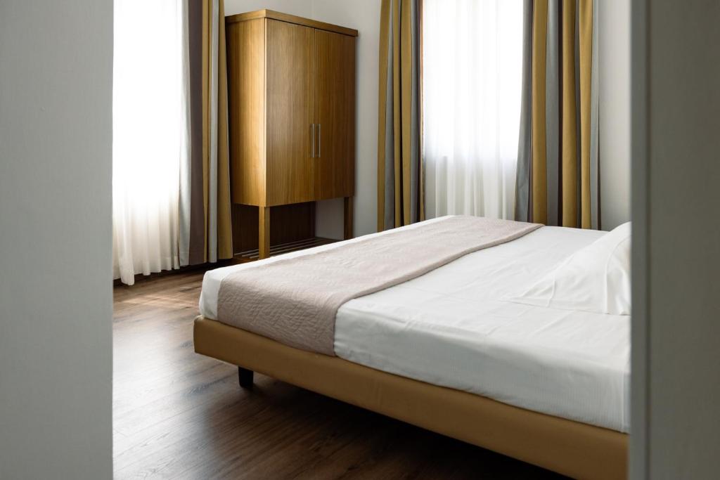 Postel nebo postele na pokoji v ubytování Hotel Trieste