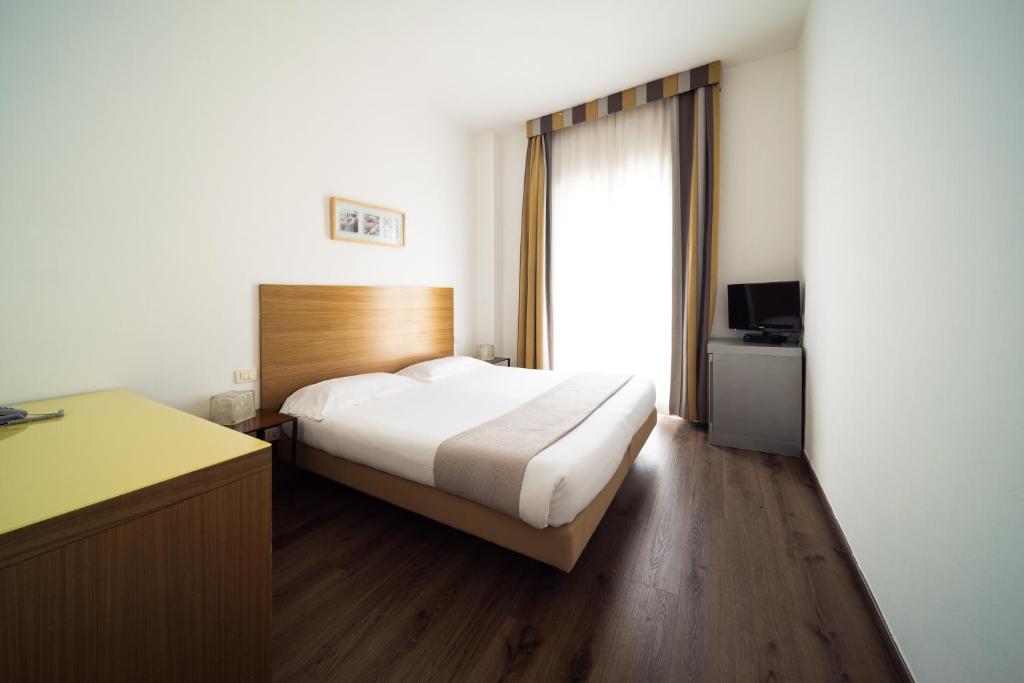 Postel nebo postele na pokoji v ubytování Hotel Trieste