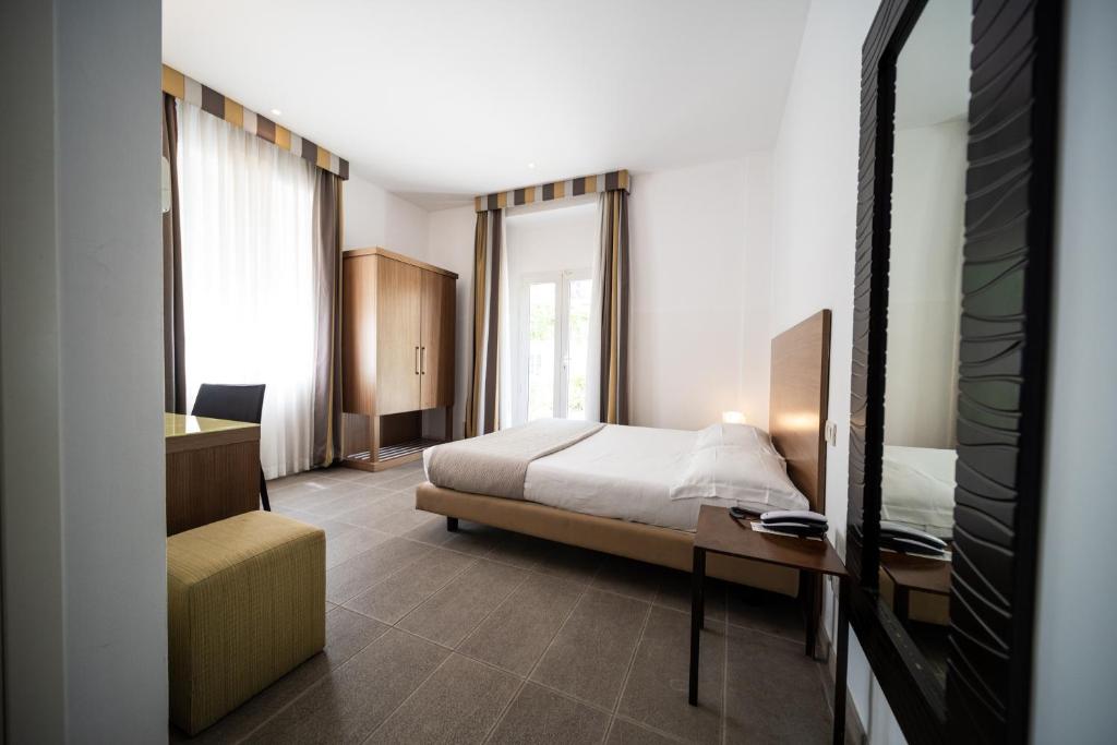Postel nebo postele na pokoji v ubytování Hotel Trieste