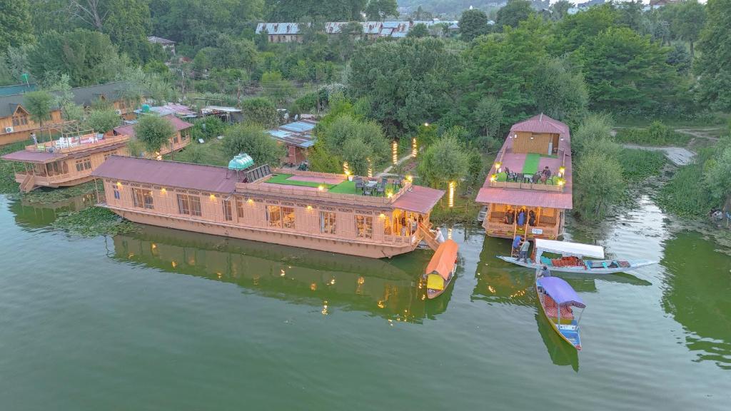 an aerial view of a river with boats in the water at Peacock Houseboats in Srinagar