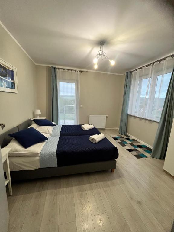 Posteľ alebo postele v izbe v ubytovaní Apartamenty-Kudowa z pięknym widokiem i balkonem
