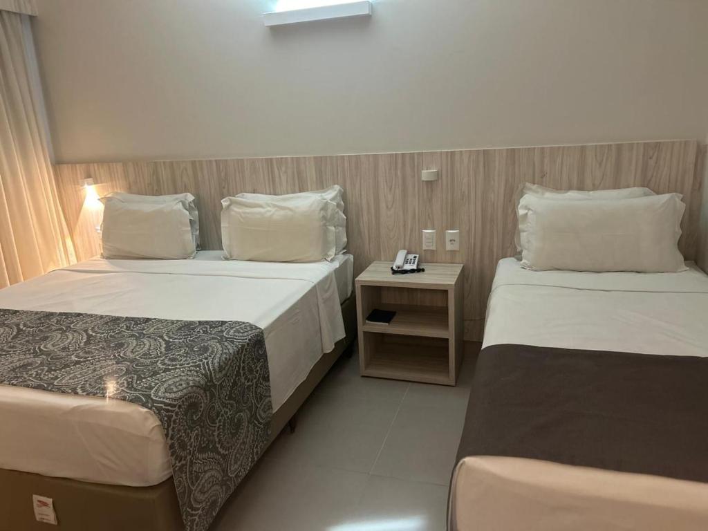 Postel nebo postele na pokoji v ubytování AlphaPark Hotel