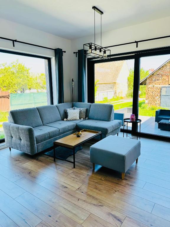 a living room with a couch and a table at Apartmány 400 in Veľká Lomnica