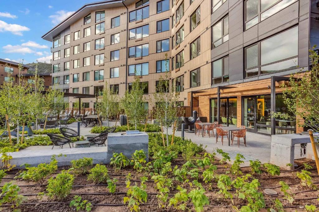 a garden in front of a building at Electric Pass Lodge by Snowmass Vacations in Snowmass Village