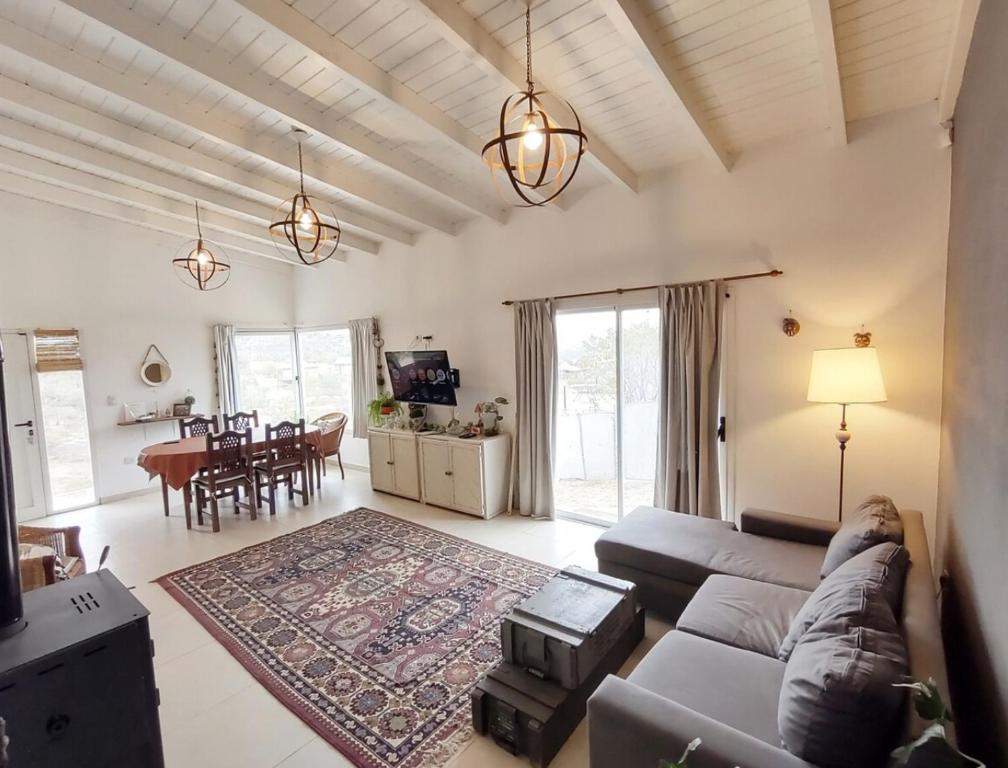 a living room with a couch and a table at Mauro y Sonia in Estancia Vieja