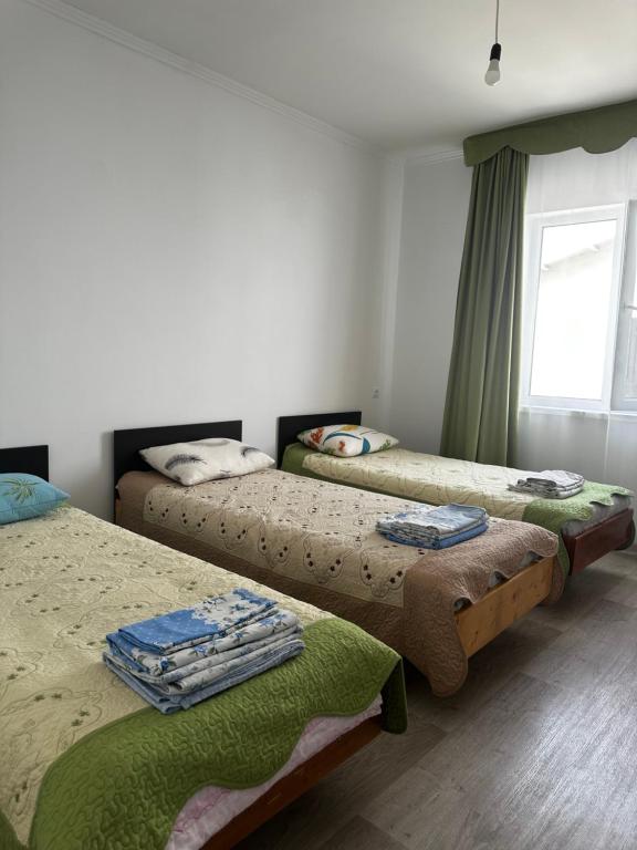 Postel nebo postele na pokoji v ubytování Guest House Arbat