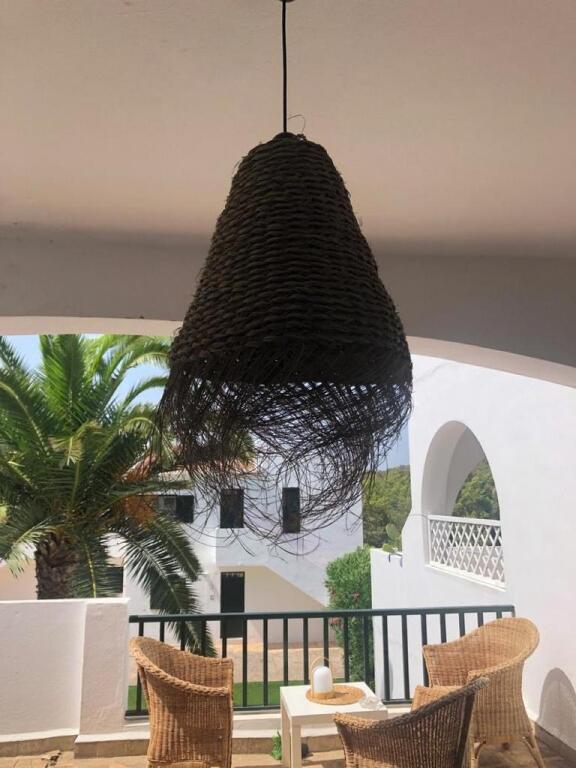 a chandelier hanging from the ceiling in a patio at Son Parc - Albatros in Son Parc