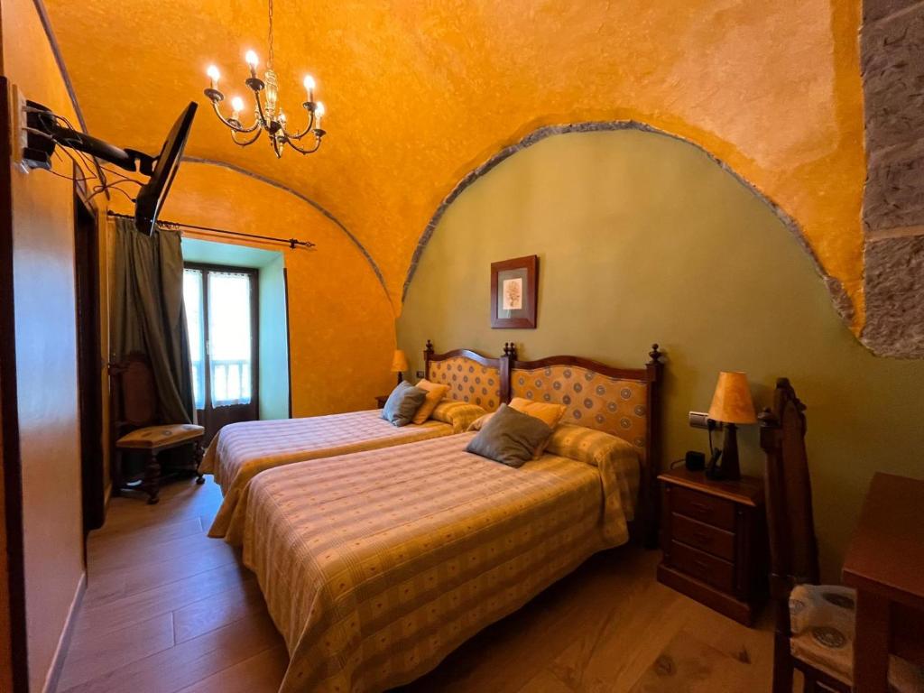 Postel nebo postele na pokoji v ubytování Hotel Larrañaga