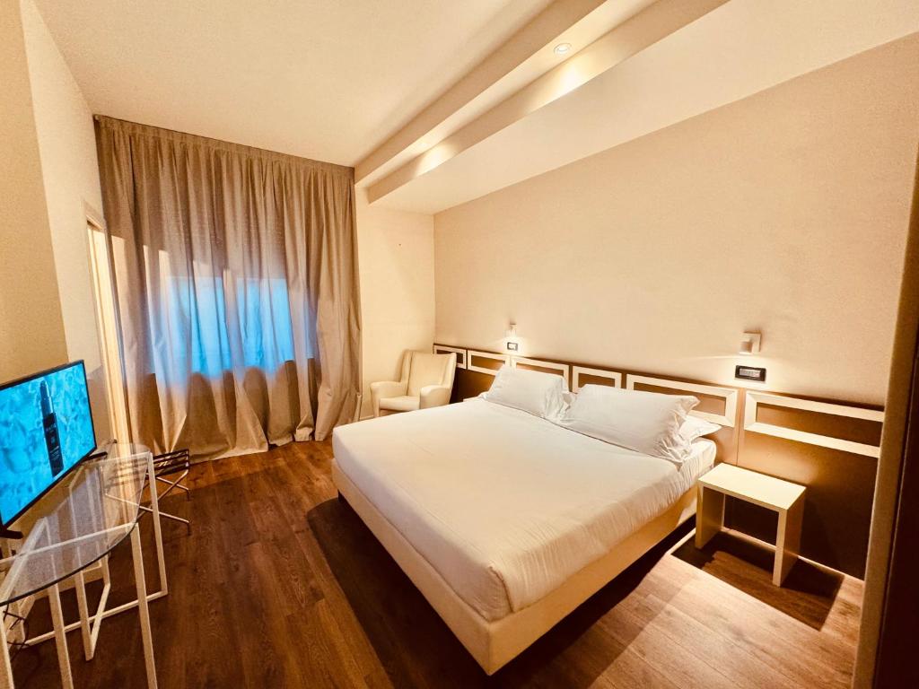 Postel nebo postele na pokoji v ubytování Hotel Pex Mantova