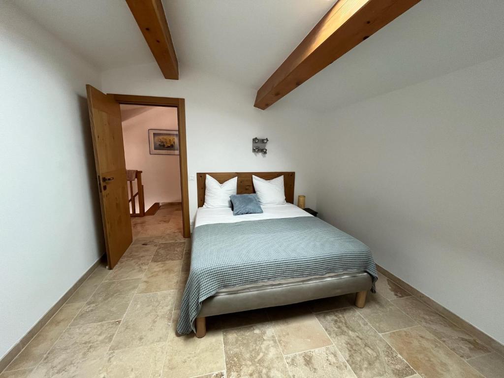 Postel nebo postele na pokoji v ubytování Les Villas du Parc