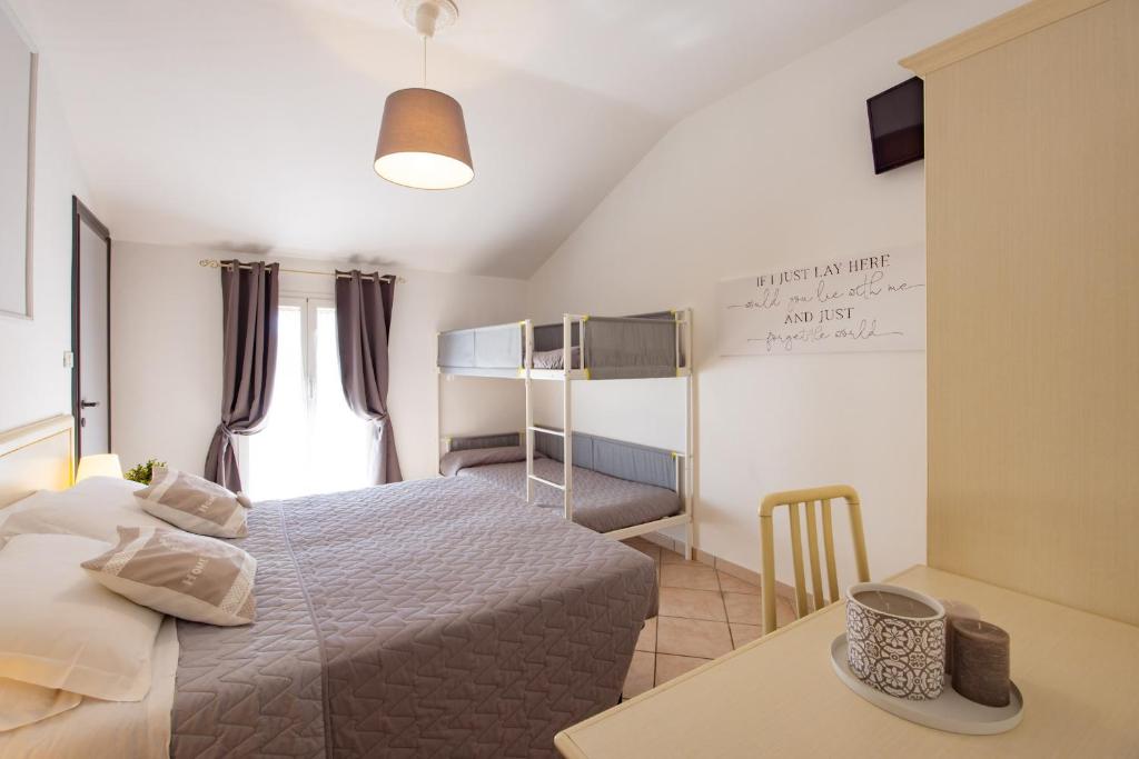 Postel nebo postele na pokoji v ubytování Hotel Il Nido