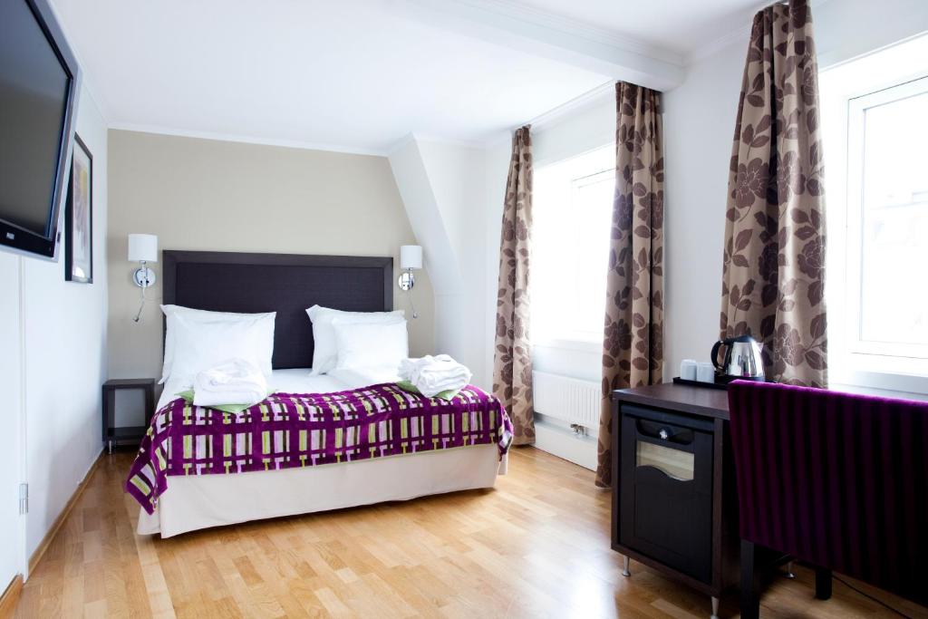 Postel nebo postele na pokoji v ubytování Quality Hotel Augustin