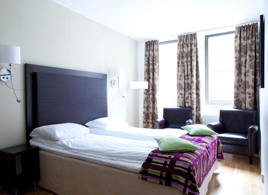 Postel nebo postele na pokoji v ubytování Quality Hotel Augustin