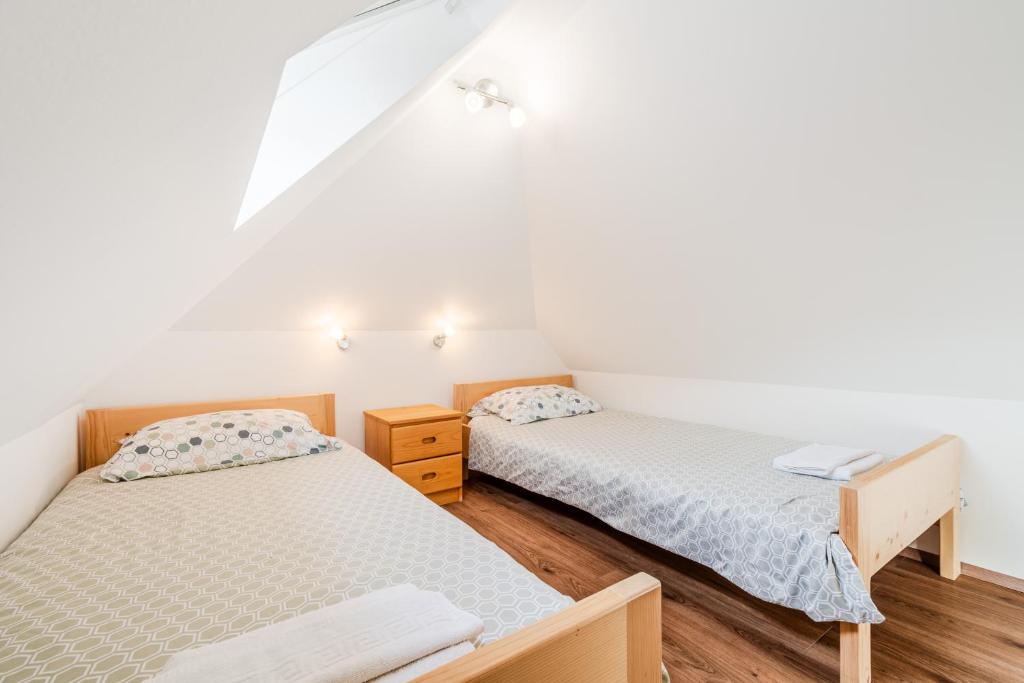 Posteľ alebo postele v izbe v ubytovaní Apartmaji Mouse